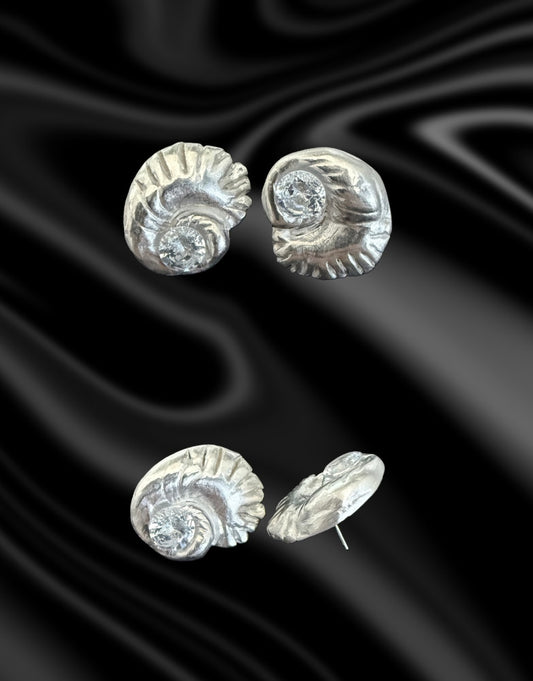 Embrace the beauty of the sea with these exquisite seashell stud earrings, meticulously handcrafted from precious Art Clay Silver—refined into .999 pure fine silver for a radiant, lasting finish. Each earring captures the graceful curves of a seashell, symbolizing peace, renewal, and a deep connection to nature.